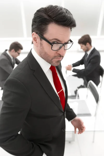 Close up.serious boss standing in the conference room. — Stock Photo, Image