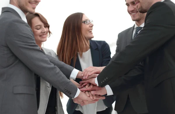 Close-up of people holding hands together while — Stock Photo, Image