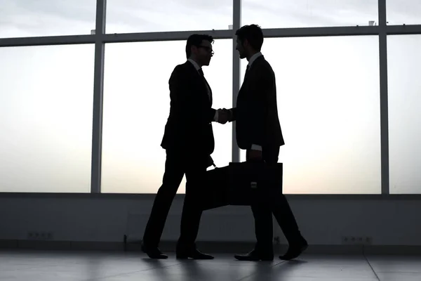 Businessmen stretching out their hands for a handshake — Stock Photo, Image