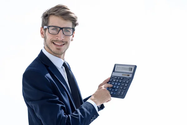 Mann zeigt auf Taschenrechner — Stockfoto