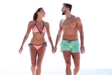 Elele ve plajda çalışan bir çift.