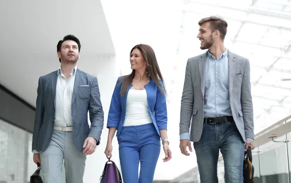 smiling staff walking in the business center.