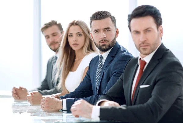 Business group sitting at the negotiating table — Stock Photo, Image