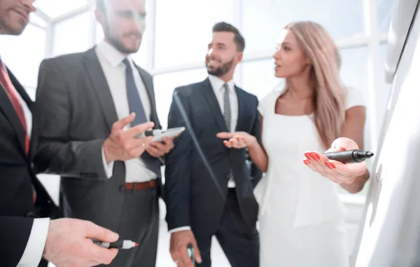 Close up.business partners discussing new presentation — Stock Photo, Image