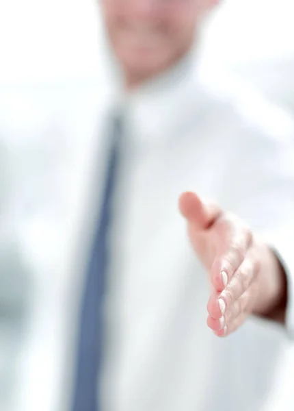 Immagine offuscata. uomo d'affari che tende la mano per una stretta di mano — Foto Stock