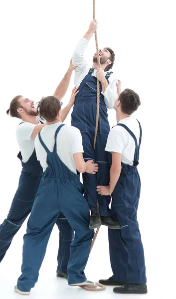 Group workers help the companion to climb up — Stock Photo, Image