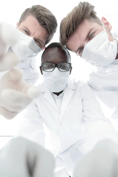 Close up.a group of scientists conducting a scientific experiment — Stock Photo, Image