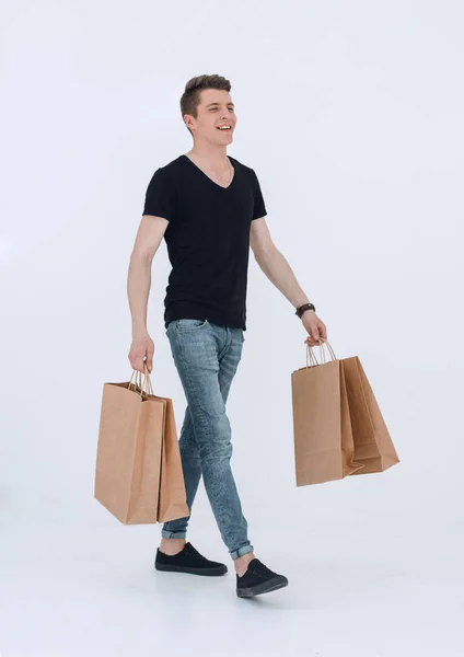 Handsome man in a black T-shirt with a bag — Stock Photo, Image