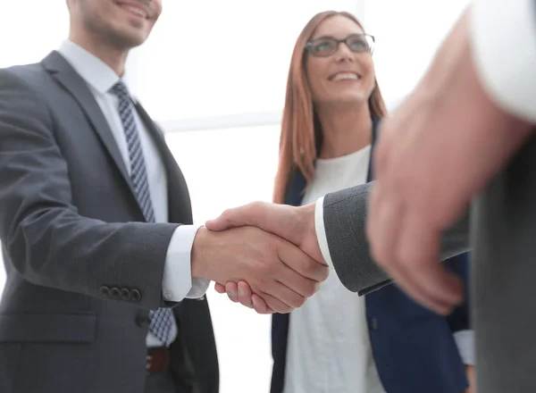 Business shaking hands in the office — Stock Photo, Image