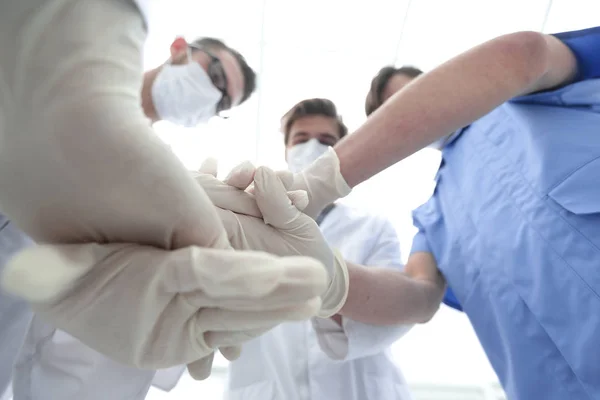 Bottom view.the surgical team showing their unity. — Stock Photo, Image