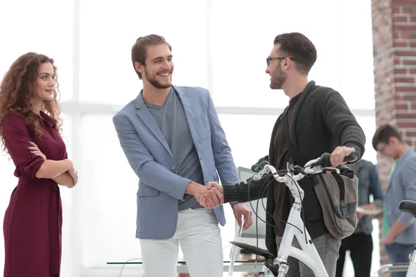 vendor congratulating a client for a new bike