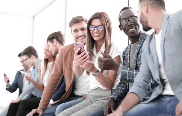 group of young people with smartphones