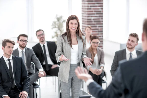 Business woman asks a question at a business seminar — Stock Photo, Image