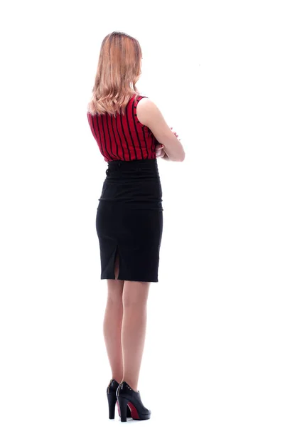 Elegant woman in business black skirt leaves. Back view. — Stock Photo, Image