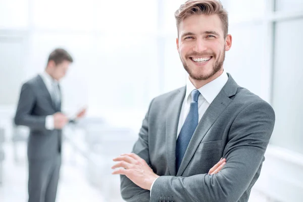 Successful businessman on the background of the office — Stock Photo, Image