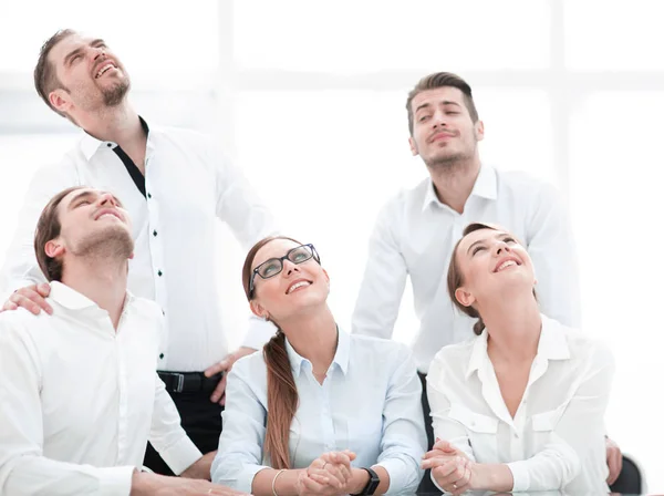 Dreaming business team looking up at copy space. — Stock Photo, Image