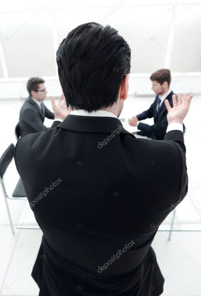 rear view.businessman holds a working meeting.