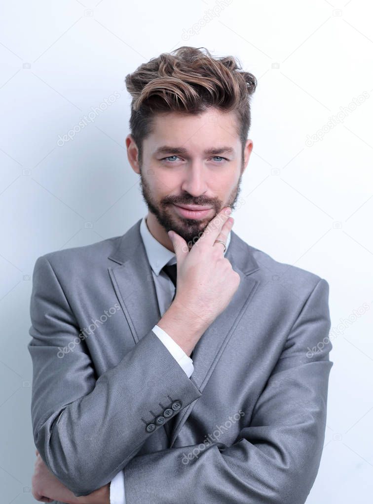 young businessman posing with crossed arms.