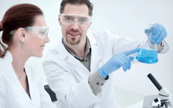 Close up.two scientists discuss the results of testing. — Stock Photo, Image