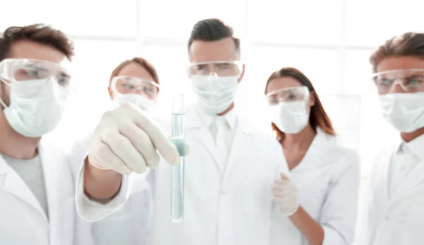 Closeup of a group of medical workers working with liquids — Stock Photo, Image