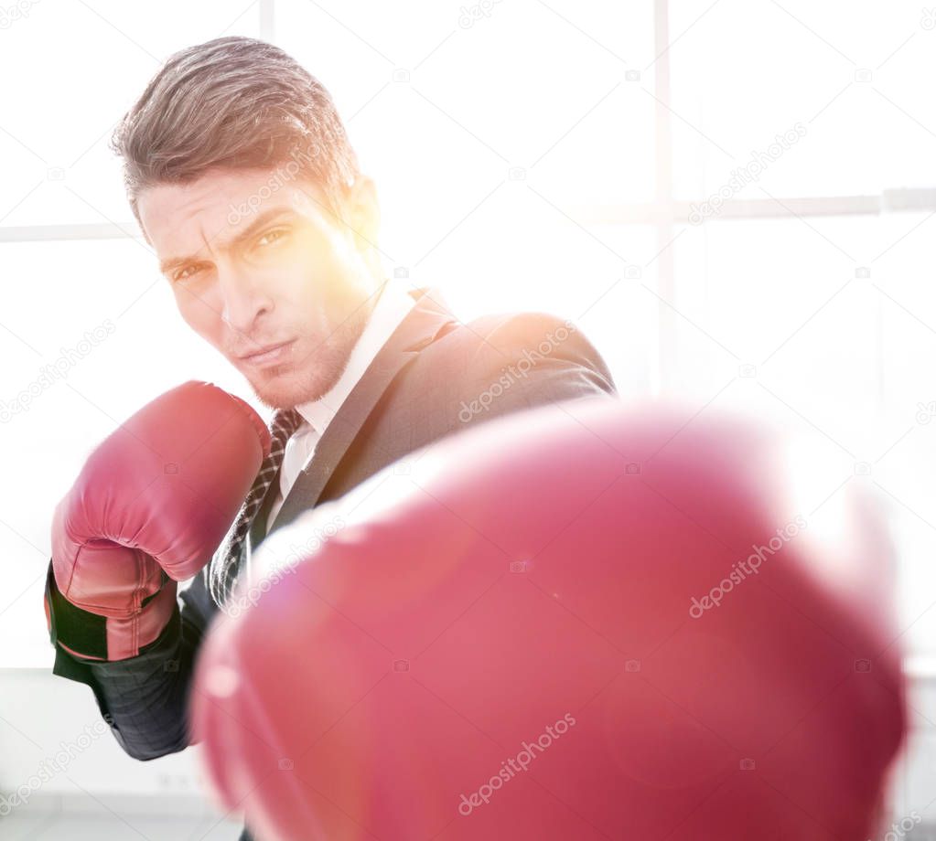 confident young businessman in Boxing gloves