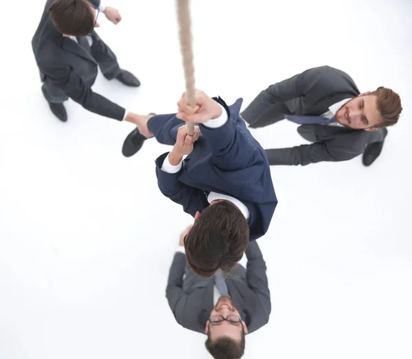 Vista superior. Equipe de negócios ajuda o líder a subir . — Fotografia de Stock
