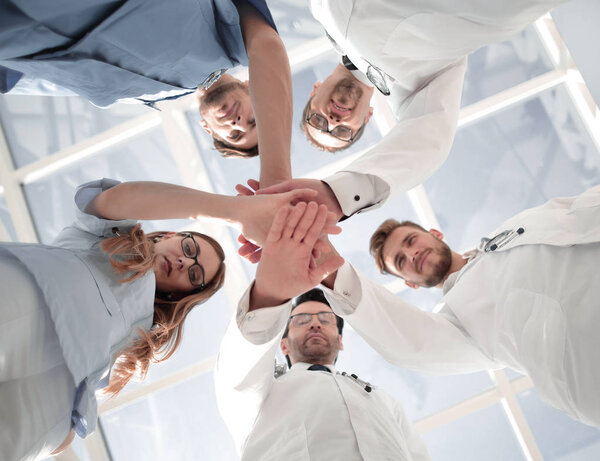 Portrait of a doctor team connecting hands stacking