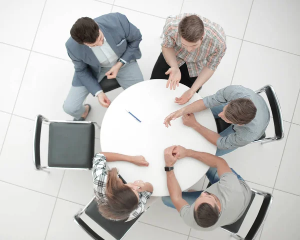 Top view.Manager and creative team sitting at the round table — Stock Photo, Image