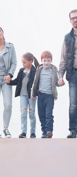 Modern family with two children walking together — Stock Photo, Image