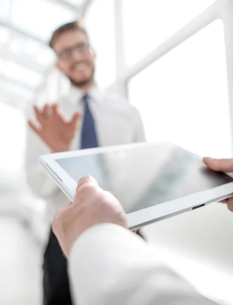 Close up.businessman with digital tablet on office background — Stock Photo, Image