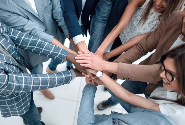 Close up.Business people holding hands in a circle — Stock Photo, Image