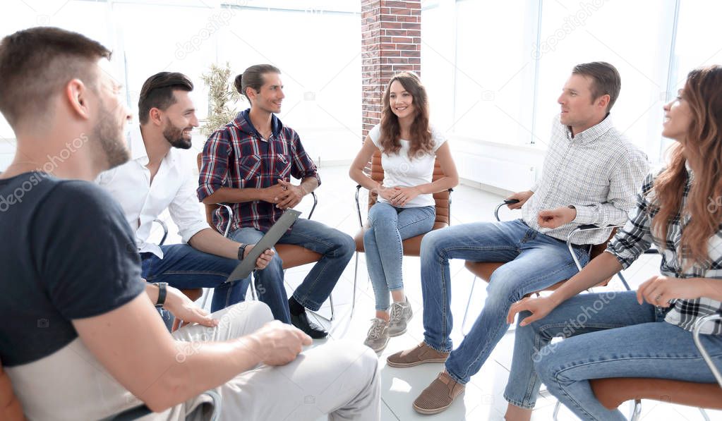 team sitting in a lesson on team building