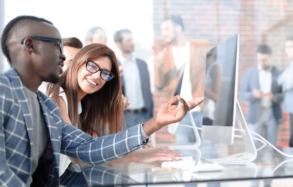 company employees discussing work issues at the Desk