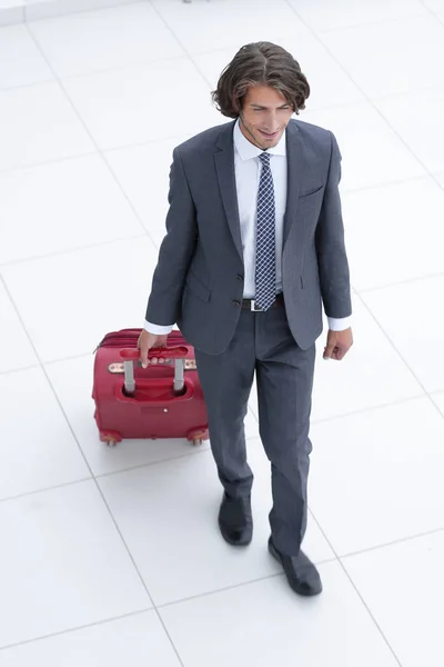 Homem de negócios com bagagem .isolated no branco . — Fotografia de Stock