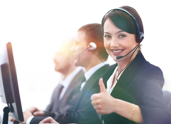Manager of the call centre shows thumb up sitting at your Desk — Stock Photo, Image