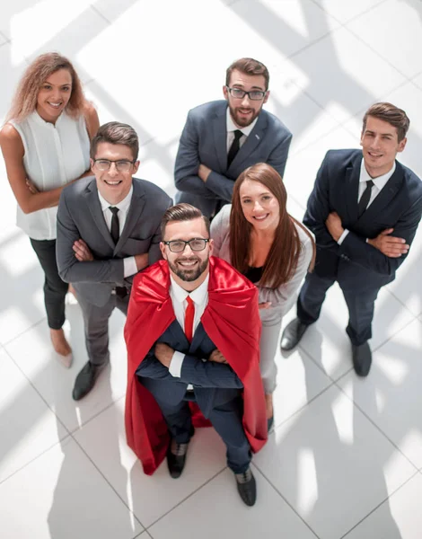 Top view.businessman superhéroe y su joven equipo de negocios — Foto de Stock