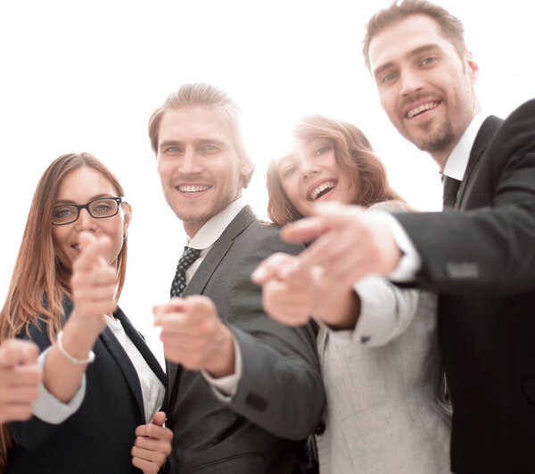 A group of people in business clothes and pointing at you