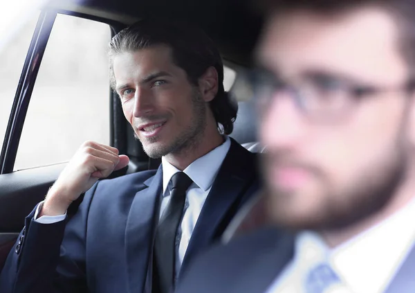 Business people sitting in car — Stock Photo, Image