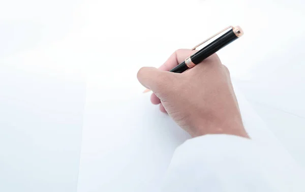 Close up. the scientist makes a record on a blank sheet — стоковое фото