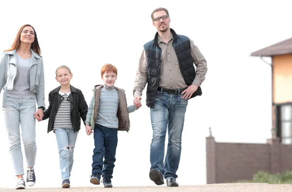 In full growth.a young family with their children walking towards their dream — Stock Photo, Image