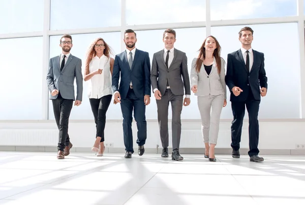 Successful business walking in the office lobby — Stock Photo, Image