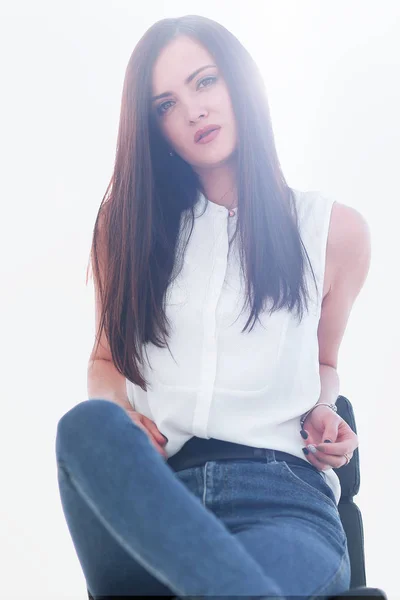 Young successful woman sitting in a chair — Stock Photo, Image