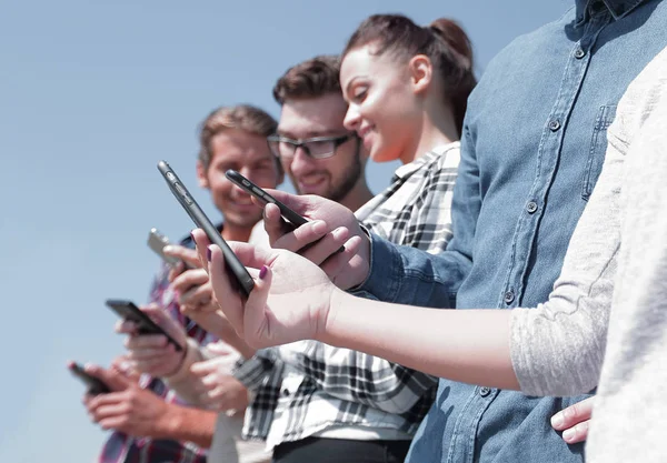 Group of young people with modern gadgets — Stock Photo, Image