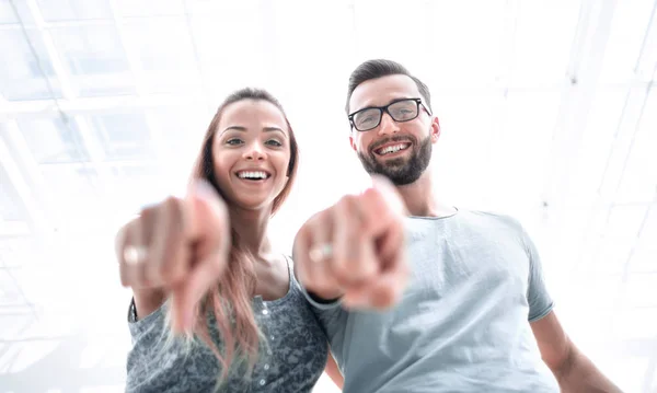 Close up. Happy couple pointing at you . — стоковое фото