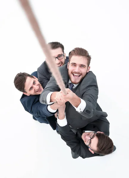 Equipo de negocios ayudando al director a trepar la cuerda . —  Fotos de Stock