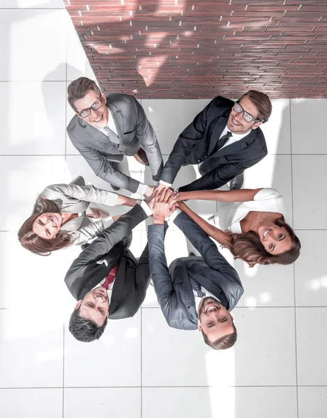 Top view of business people with their hands together in a circle — Stock Photo, Image