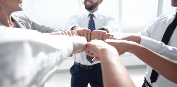 close up.a group of business people showing their unity