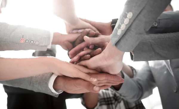 Closeup of a business colleagues with their hands stacked together Stock Picture