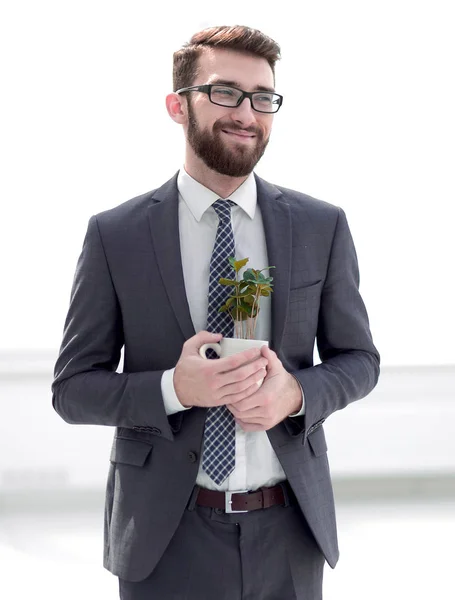 Empresário com novo broto isolado em branco — Fotografia de Stock