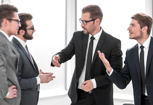 Group of business people standing in the office — Stock Photo, Image